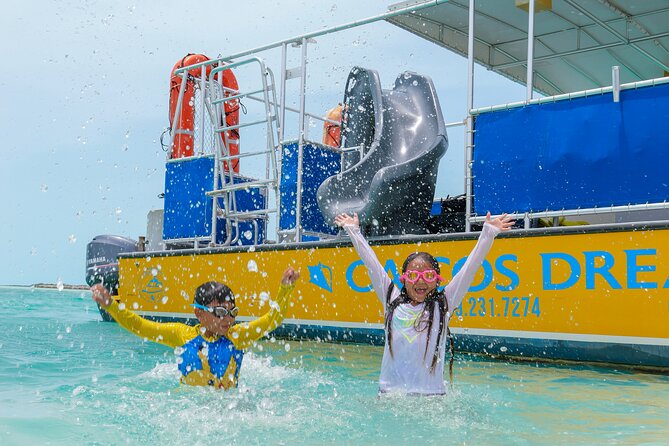 Afternoon Half Day Cruise from Providenciales with Snorkeling and Iguana Island - Boat Fun in Turquoise Water: Slide, Jumping Platform, and Drinks